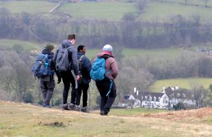 Group of people out walking in the countryside